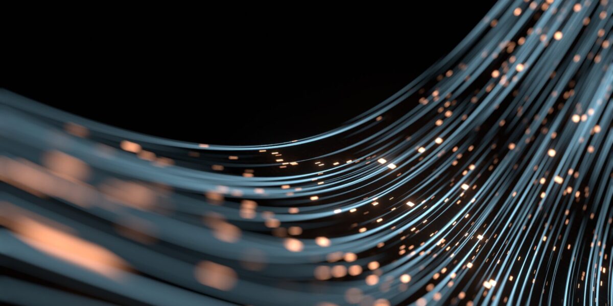 Curved strands of blue and orange light form sweeping lines against a black background, resembling glowing fiber optic cables or abstract data streams with small illuminated dots scattered throughout.