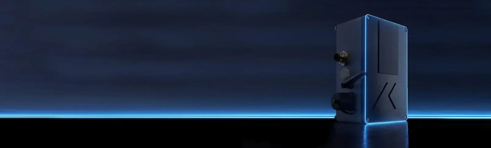 A tall, sleek, dark blue device with subtle lighting accents stands upright on a reflective surface against a dark, gradient blue background with a horizontal glow near the bottom.