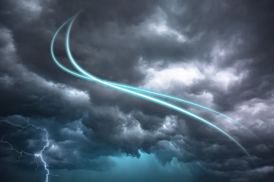 Dark storm clouds fill the sky with bright blue lightning at the bottom left. Two curved, glowing blue light trails arc through the center of the clouds, creating a dramatic and surreal effect.
